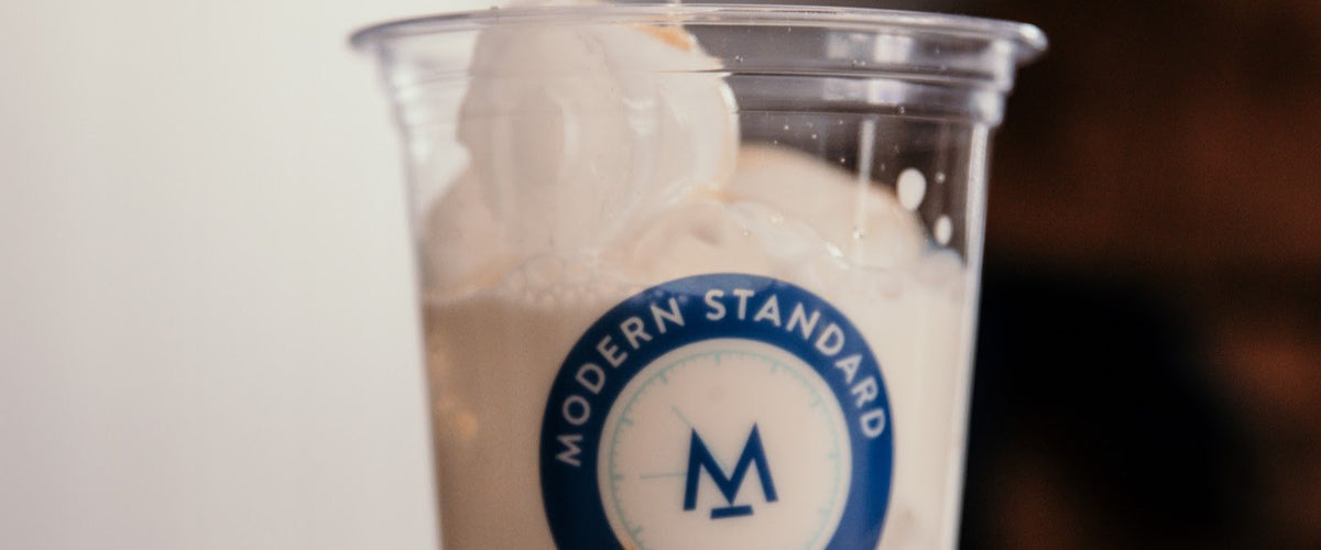 Iced caramel latte in a Modern Standard cup