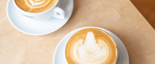Latte with latte art on a café table