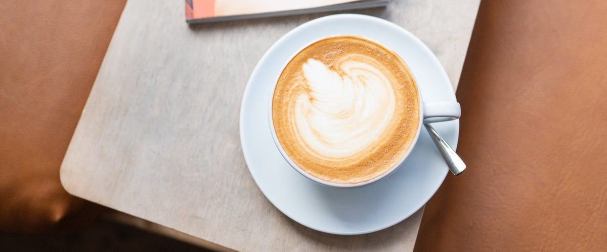 Oat milk latte with latte art