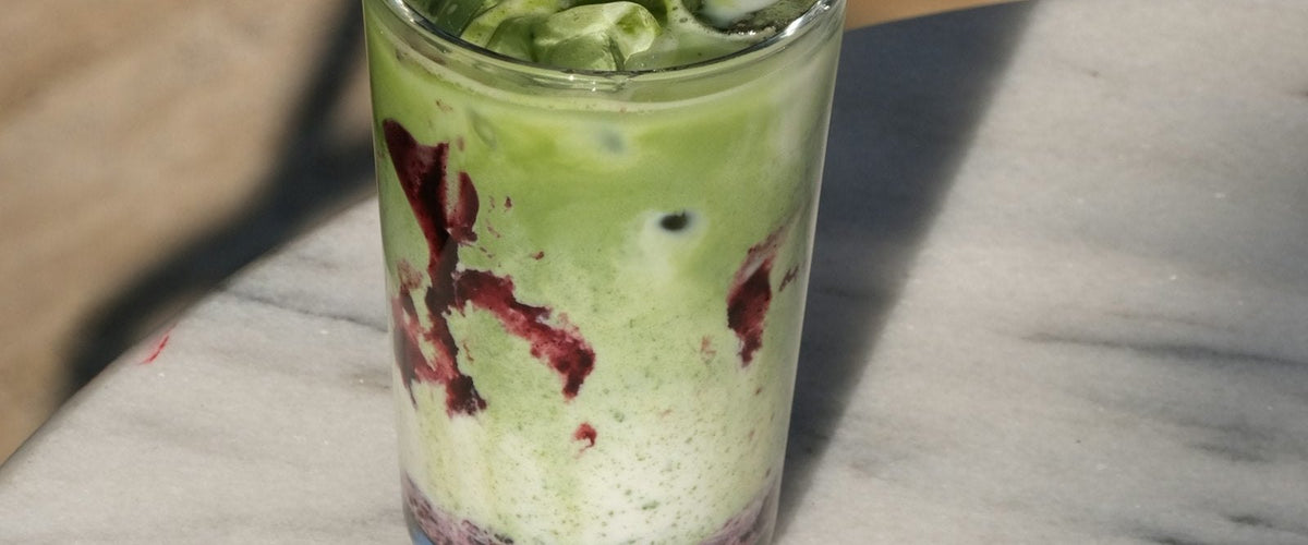 Iced strawberry matcha with a pink strawberry layer