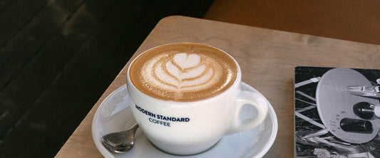 Latte with latte art in a Modern Standard cup