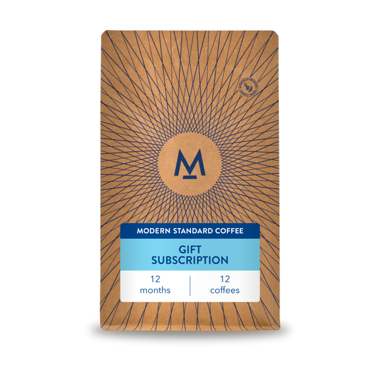 12 month gift subscription: a Modern Standard Coffee bag with a blue gift subscription label, 12 months, 12 coffees