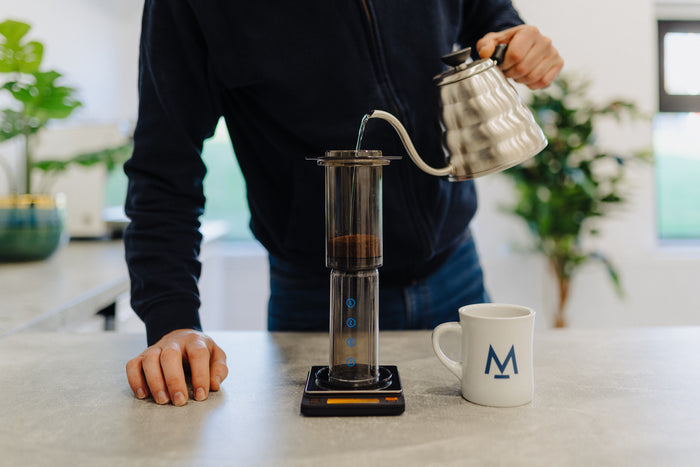 Adding ground coffee to the AeroPress