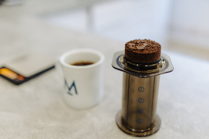 Popping the used coffee puck out of the AeroPress