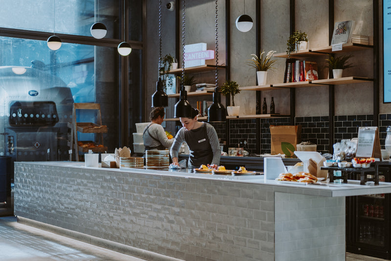 Channel 4 staff café counter with baristas serving coffee and food