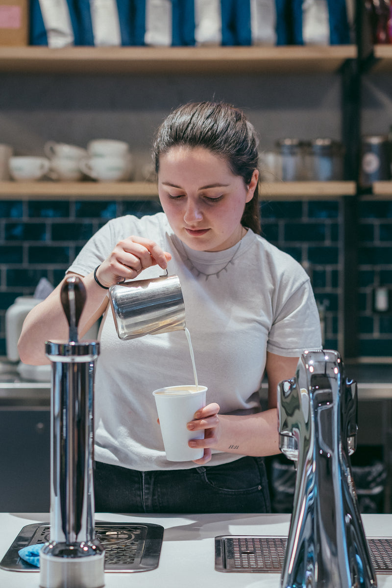 Barista pouring latte art at the Modbar at Channel 4