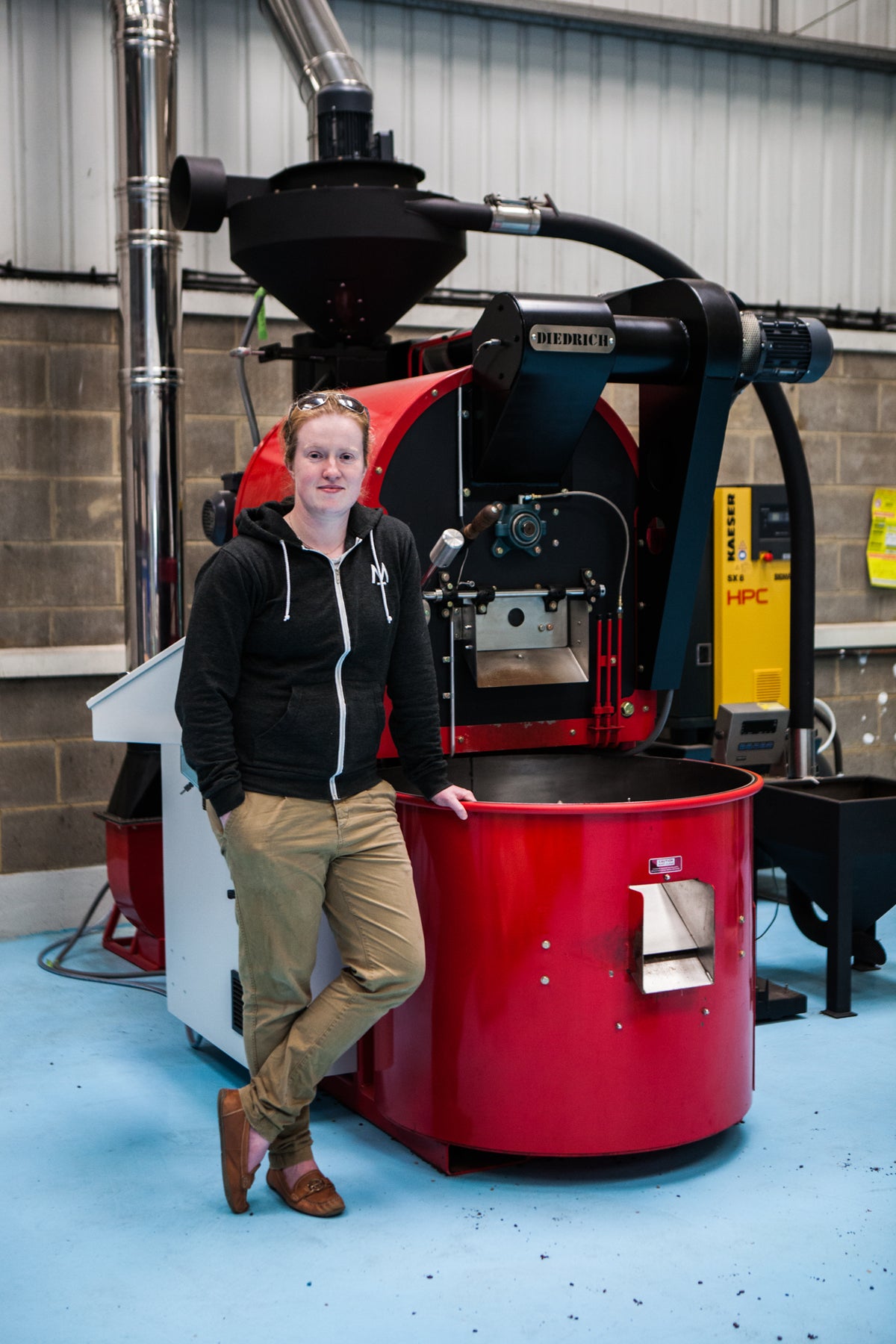 Standing beside the red 20kg Diedrich roaster that Modern Standard started on