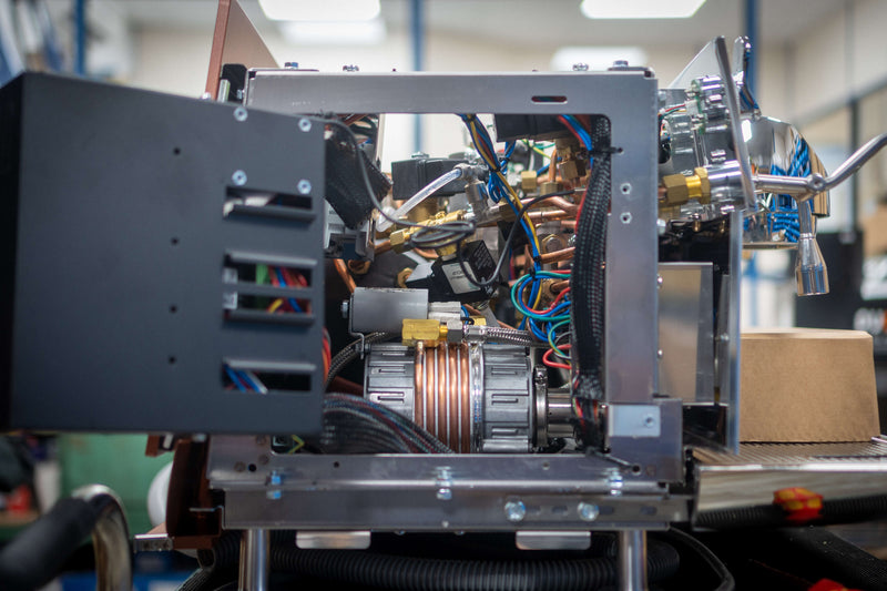 An espresso machine opened up for servicing in the Modern Standard Service workshop
