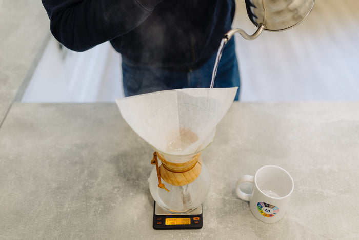 Rinsing the Chemex filter with hot water