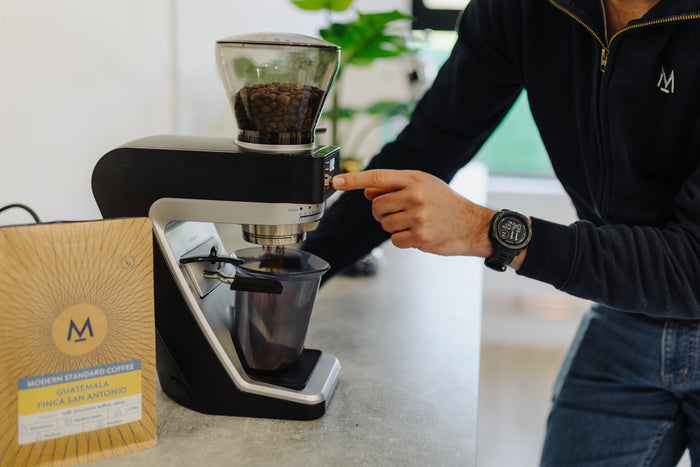 Weighing and grinding coffee beans