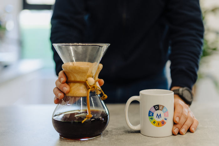 Pouring Chemex coffee into a mug