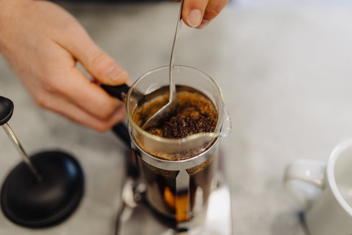 The cafetière steeping with the lid resting on top