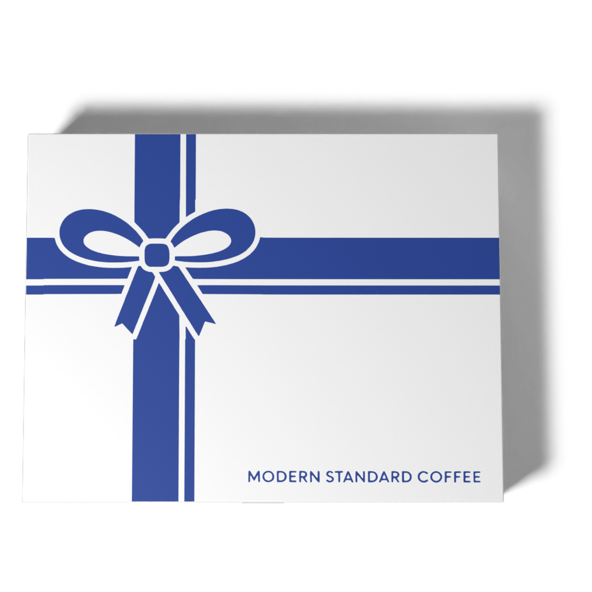 Top-down view of the ribbon-and-bow gift box lid