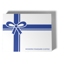Top-down view of the ribbon-and-bow gift box lid