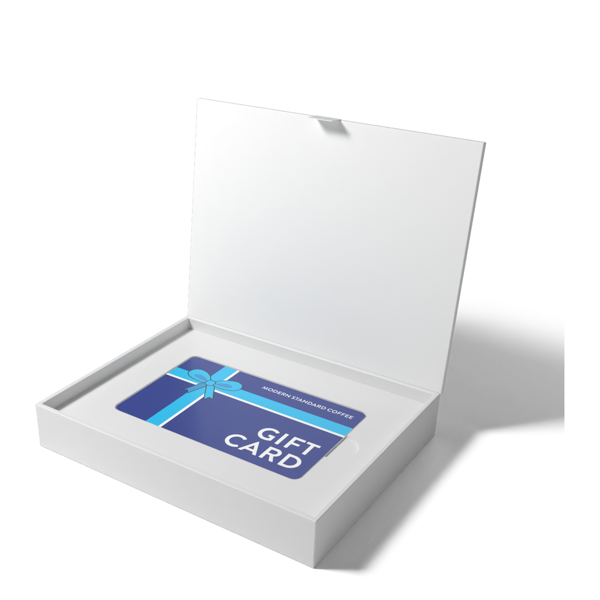 Open magnetic gift box holding the Modern Standard Coffee gift card