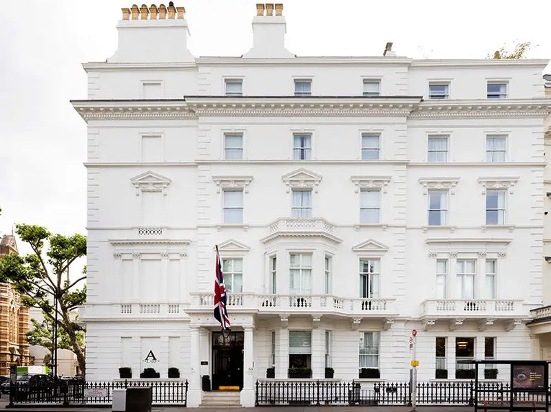 A white stucco boutique hotel in South Kensington, London