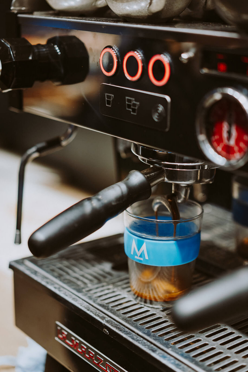Espresso pouring into a Modern Standard Coffee KeepCup at Ole & Steen
