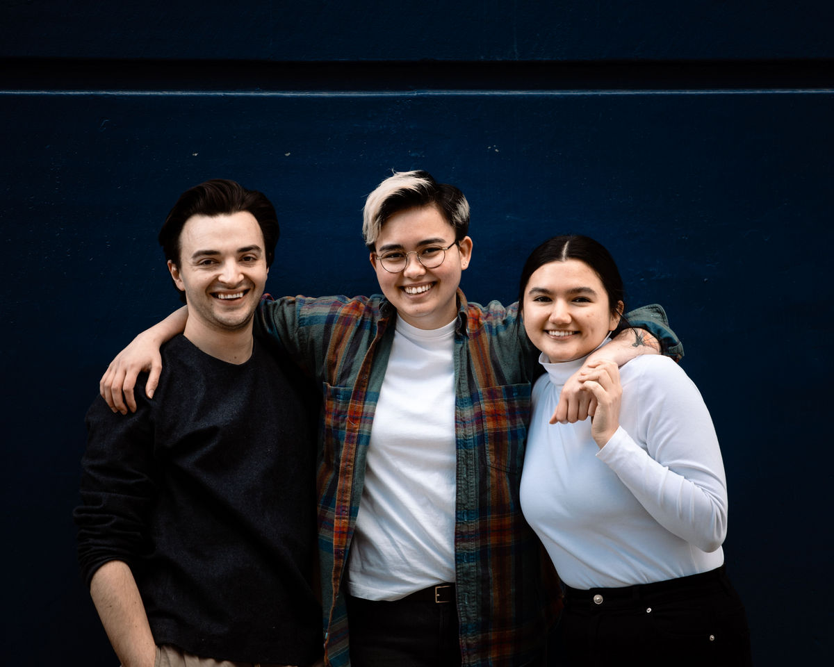 Three members of the Modern Standard team smiling together